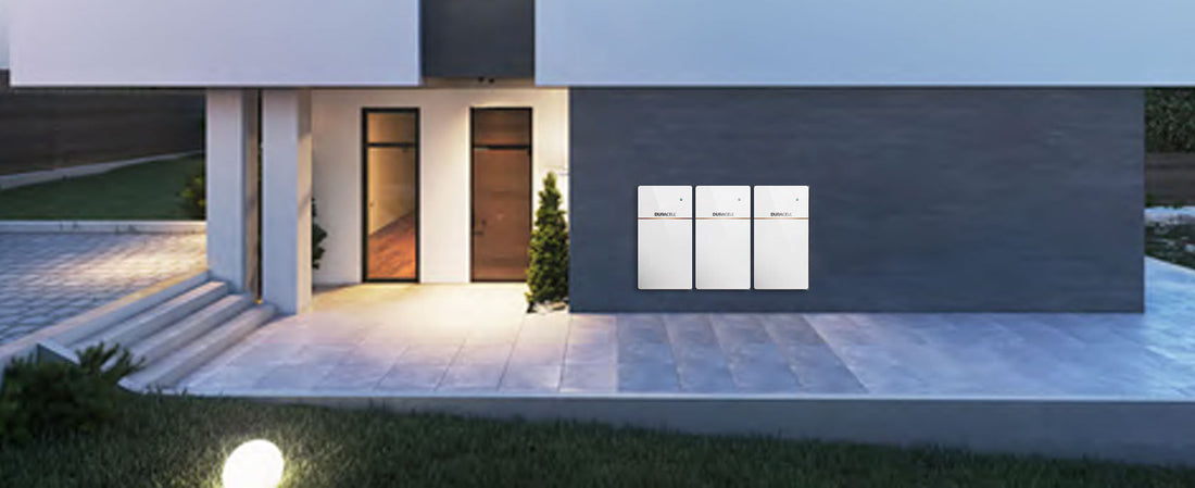 Duracell power inverters installed on the outside of a modern-looking house